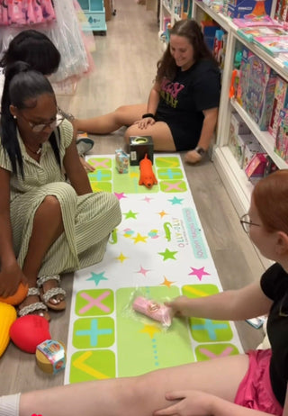 Friends trading squishies on the squishy trading station mat at Olly-Olly in Baton Rouge