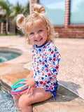 Rufflebutts Shimmer Star Spangled L/S Rashguard 1Pc Swimsuit