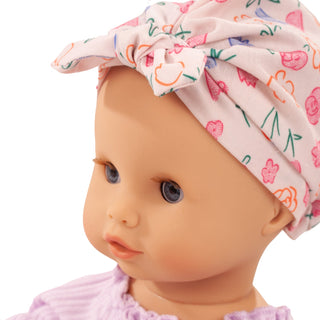 Close-up of Götz Sleepy Aquini BliBlaBlume doll with blue sleeping eyes