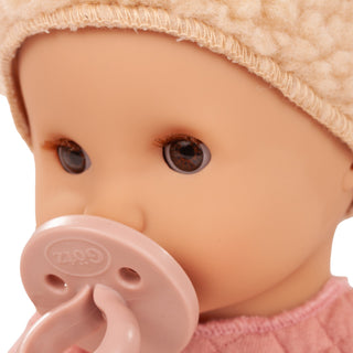 Close-up of Sleepy Aquini Beary Girl doll face with pacifier