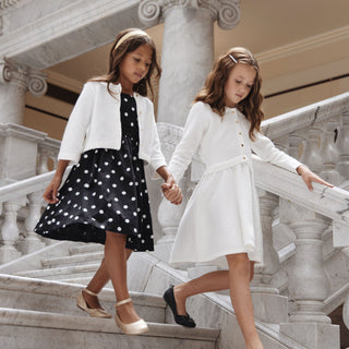 Girl wearing Hope & Henry Soft White Tweed cropped scallop cardigan