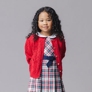 Girl wearing Hope & Henry Red Diamond pointelle cardigan sweater