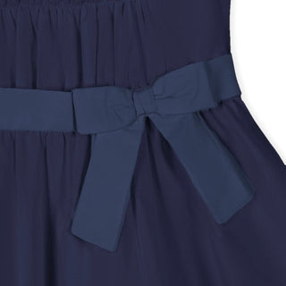 Navy puff sleeve tiered party dress, back view