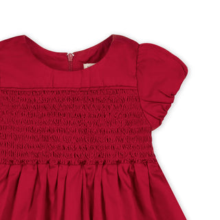 Red smocked puff sleeve baby dress, back view