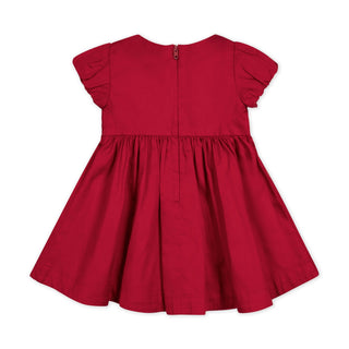 Red smocked puff sleeve baby dress, detail view