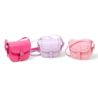 Girl wearing pink saddle stud crossbody bag
