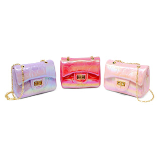 Girl carrying pink shiny dotted heart crossbody handbag
