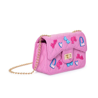 Pink Barbie quilted kids purse with metal charms, angled view