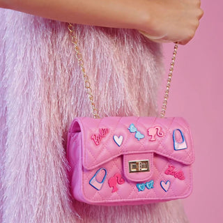 Girl carrying Barbie Classic Quilted pink handbag