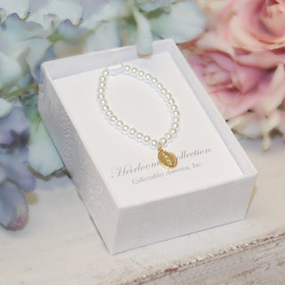 Gold Mary Medal on a glass pearl stretch bracelet