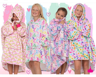 Azarhia Fuzzy Buddy hooded coverups in Feeling Grinchy, Dancing Bows, Cool Cats and Sugar Rush prints