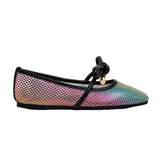 Multicolored flat shoe with a black bow on a white background