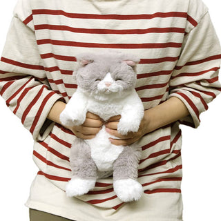 Sunlemon sleeping lap cat plush resting on a lap