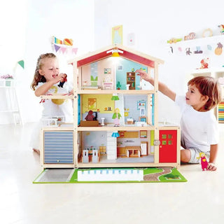 Hape wooden dollhouse with furniture and doll family