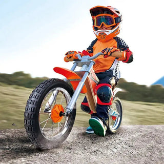 Child riding the Hape Off Road Balance Bike outdoors