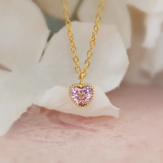 Pink cubic zirconia heart pendant on a gold-filled necklace