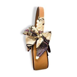 Doe-A-Dear beige saddle purse side view