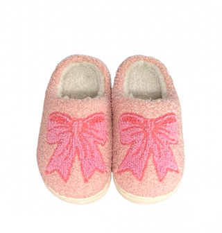 Pink slippers with a bow design on a white background