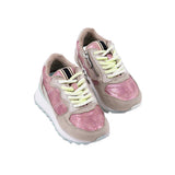 Pink and beige sneakers with white laces on a light gray background