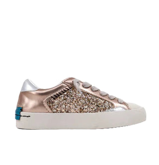 Rose gold sneaker with glittery design on a white background